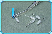 Photograph of a replacement pack of interdental brush and a few interdental brush heads.