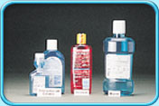 Photograph of a few bottles of anti-plaque mouthwashes in different brands.