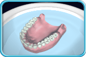 Photograph showing a denture being immersed in water.