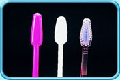 Photograph of several toothbrushes with their brush heads in diamond shape.