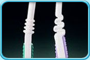 Photograph of two tooth brushes with flexible handles.
