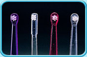 Photograph of several types of single-tuft toothbrushes with different shapes.