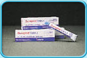 Photograph showing several tubes of fluoride varnish.