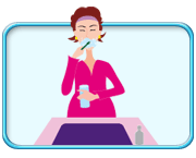 Photograph of a pregnant woman brushing her teeth.